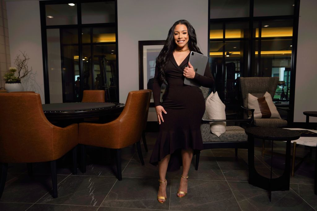 Erika Baez-Grimes in a modern lounge before a Deal Room session